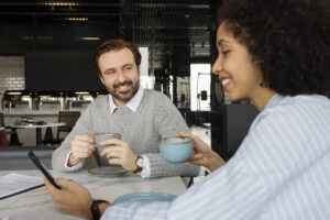 Mentor and mentee connecting over coffee.