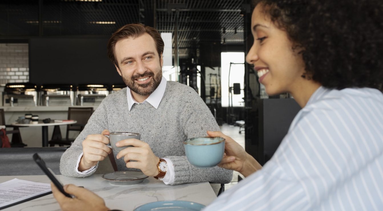 Mentor and mentee connecting over coffee.